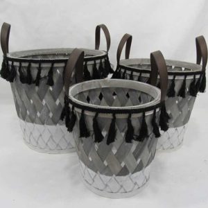 wooden storage basket with faux leather handle and tassels